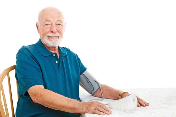 Senior Checking Blood PRessure